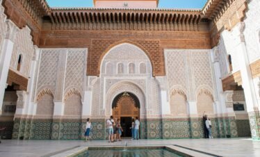 A group of people standing around a pool in a building