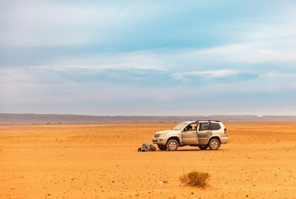 a car parked in the middle of a desert