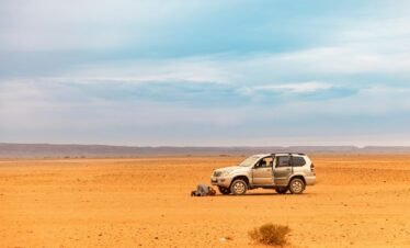 a car parked in the middle of a desert